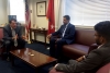 Steve Haro, Assistant Secretary for Legislative and Intergovernmental Affairs, interacts with colleagues in his office.