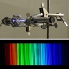 A thorium emissin lamp&#039;s violet glow, when viewed through a spectroscope, is split into a spectrum of thousands of bright lines.  New measurements of these lines could help astronomers search for earthlike planets around distant stars.