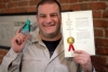 Steve Katsaros, Founder and CEO, Nokero International Ltd. holding his patent