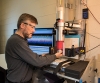 NIST Materials Scientist Michael Riley prepares a sample of material for a drop test that will reveal its ability to absorb and dissipate energy. This was one of a series of tests that helped the Head Health III judges identify five materials that held th