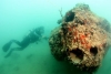 A diver examines the gunner&#039;s forward turret on a PBY-5 Catalina resting on its right side in Kāne‛ohe Bay, Hawaii. The plane was sunk at Pearl Harbor on Dec. 7, 1941. Credit: UH Marine Option Program