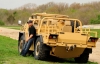 Thomas Hiromoto, Lockheed Martin engineer, leans against the Common Vehicle