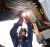 A US Navy welder works at the Puget Sound Naval Shipyard. Photo courtesy US Navy.