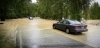 Photo of cars on a flooded road.