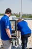 Link Labs hardware engineers installing a rooftop base station in Maryland.