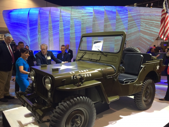 Secretary Pritztker views the 1960’s Army vehicle Willy&#039;s Jeep at the International Technology Show (IMTS) in Chicago.