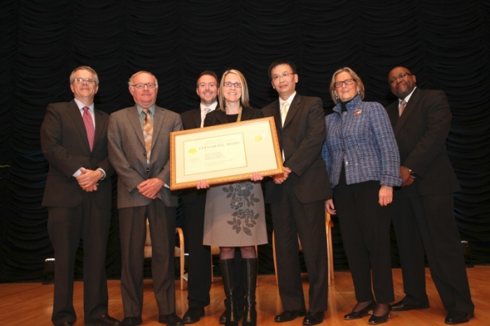 The NOAA team holding their award aside Deputy Secretary Andrews.