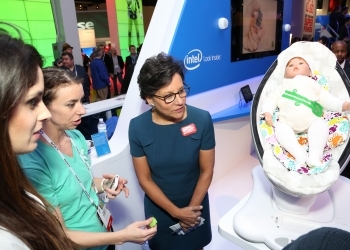Secretary Pritzker stopped by Intel's booth to look at their new wearable devices, which included a baby monitor (photo credit: Consumer Electronics Association) Secretary Pritzker stopped by Intel's booth to look at their new wearable devices, which included a baby monitor (photo credit: Consumer Electronics Association)