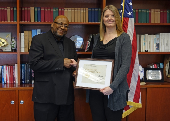 Lynda Roark receiving her award from Willie May