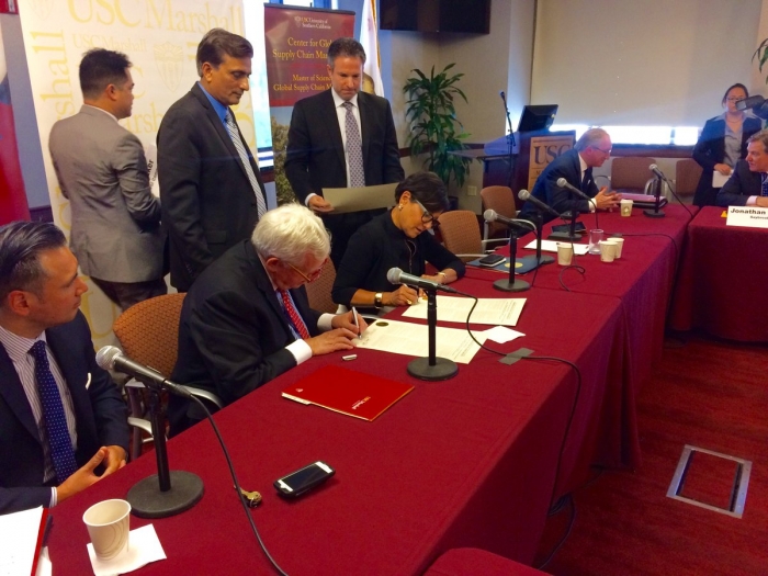 Commerce Secretary Penny Pritzker signs a strategic partnership agreement between the Commerce Department and the USC Marshall Center for Global Supply Chain Management.