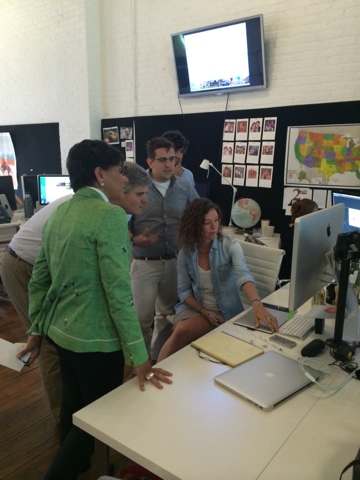Secretary Pritzker and Steve Case viewing a demonstration at RoadTrippers
