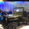 Secretary Pritztker views the 1960’s Army vehicle Willy&#039;s Jeep at the International Technology Show (IMTS) in Chicago.