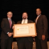 The EDA team holding their award aside Deputy Secretary Andrews.