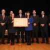 The ESA team holding their honor award aside Deputy Secretary Andrews 