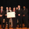 The NIST team holding their award aside Deputy Secretary Andrews.