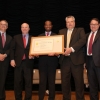 The NTIA team holding their award aside Deputy Secretary Andrews.