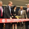Acting Deputy Secretary of Commerce Bruce Andrews (L) is joined by Senator Bennet, Deputy USPTO Director Lee, Mayor Hancock and others at the ribbon cutting for the USPTO's Denver office Acting Deputy Secretary of Commerce Bruce Andrews (L) is joined by Senator Bennet, Deputy USPTO Director Lee, Mayor Hancock and others at the ribbon cutting for the USPTO's Denver office