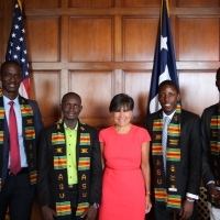 Secretary Penny Pritzker poses with four Mandela Washington Fellows