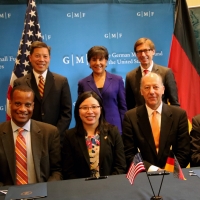Secretary Pritzker, Assistant Secretary Williams and other dignitaries pose for a group photo after the MOU signing