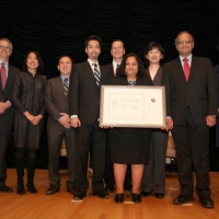 The USPTO team holding their award aside Deputy Secretary Andrews.