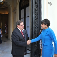 Cuban Foreign Minister Rodriguez (left) welcomes Secretary Pritzker (right)