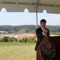 Matt Erskine speaking under tent