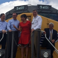 Secretary of Commerce Penny Pritzker joined U.S. and Mexican government leaders in Brownsville, Texas on the front of a locomotion engine