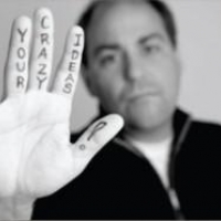 Hand with Trust Your Crazy Ideas written on it