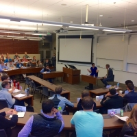 Commerce Secretary Penny Pritzker talks with students in the graduate-level Practical Policy and Politics class at Stanford University.