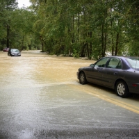 Photo of cars on a flooded road.