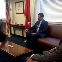 Steve Haro, Assistant Secretary for Legislative and Intergovernmental Affairs, interacts with colleagues in his office.