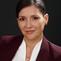 Andrea Pacheco Dhamer is Deputy Director for the Office of Business Liaison