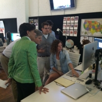 Secretary Pritzker and Steve Case viewing a demonstration at RoadTrippers