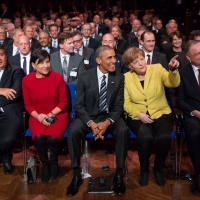 Secretary Pritzker, President Obama, and Chancellor Merkel watching the Hannover Messe Opening Ceremony