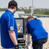 Link Labs hardware engineers installing a rooftop base station in Maryland.